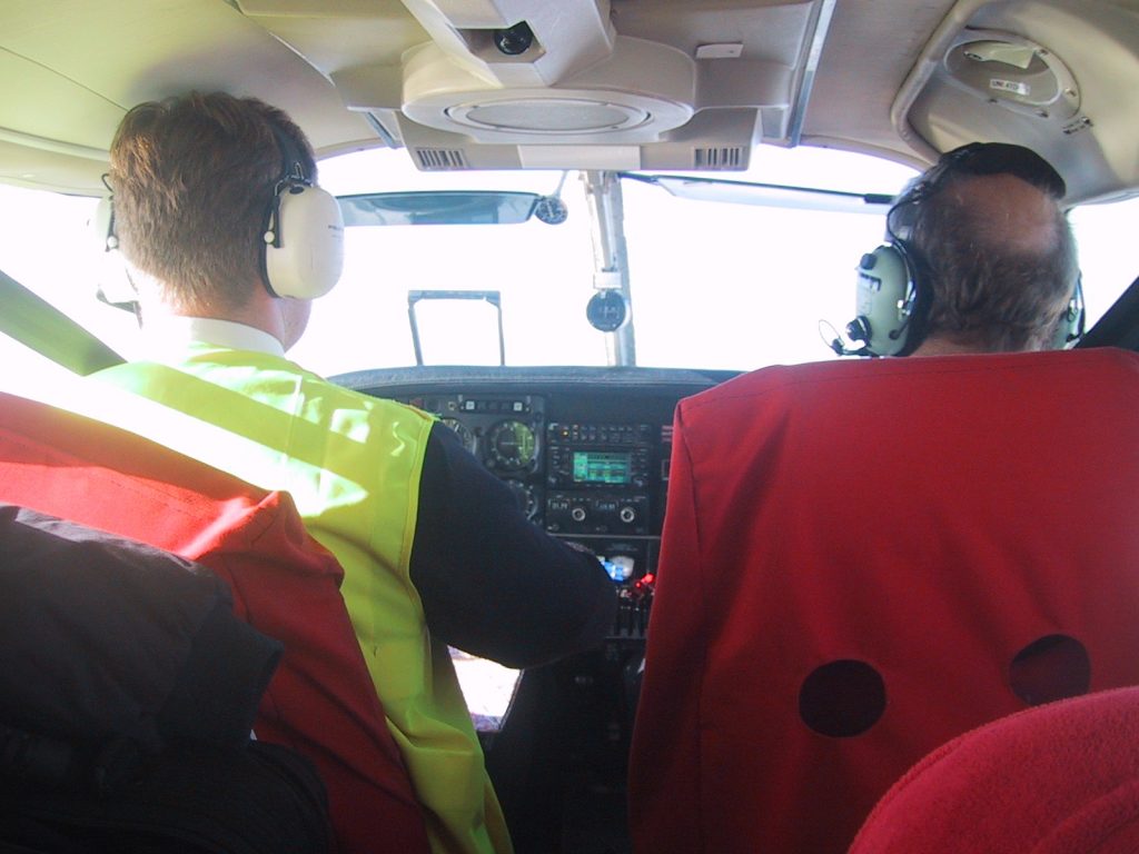 student and instructor in cockpit