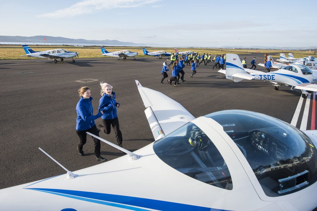 Pic Alan Richardson Dundee, Pix-AR.co.uk Free to Use from Tayside Aviation The young pilots make a dash for the planes to start the atempt at 50 training flights in just one hour! Scotland’s premier flight school is celebrating its 50th anniversary this week . Having flown 33 million miles since its launch in 1968, the equivalent of 70 trips to the moon and back, Tayside Aviation in Dundee marked 50 years in business today (Thursday 22 February 2018) by conducting 50 training flights in just one hour! The multi award-winning business has trained over 5,000 commercial airline pilots in this time, 6,000 RAF cadets and flown a staggering 1,500 flying scholarships, including 300 from as far away as Hong Kong. In addition, the company, which employs 35 staff, ploughs around £1.5 million into the local economy each year, with trainee pilots from over 12 countries coming to Dundee – and to Fife Airport - to realise their aviation dreams. Tayside Aviation trains commercial pilots for airlines across the world, particularly for Loganair, who the company has had a long and successful partnership with, and FlyBe. See press release from Grainger PR 07912324264 claire@graingerpr.co.uk